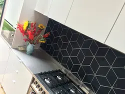 Kitchen apron made of black tiles photo
