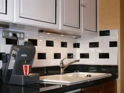 Kitchen apron made of black tiles photo