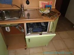 Dishwasher in the kitchen under the countertop photo