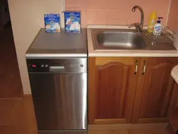 Dishwasher in the kitchen under the countertop photo
