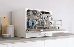 Tabletop dishwasher in the kitchen interior photo