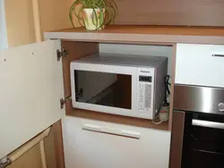 Kitchens with microwave in the upper cabinet photo