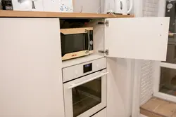 Kitchens with microwave in the upper cabinet photo