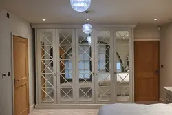 Hinged wardrobes with a mirror in the bedroom photo