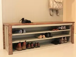 Wooden shoe rack in the hallway photo