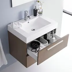Small bathroom sink with cabinet photo