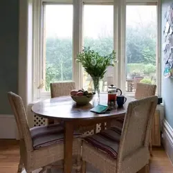 Table by the window in the kitchen living room photo
