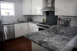 White kitchen with dark gray countertop photo