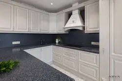 White kitchen with dark gray countertop photo