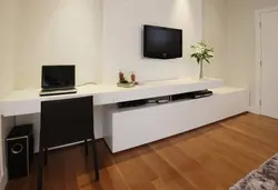 Console in the living room interior under the TV photo