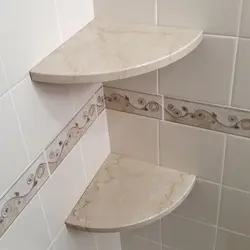 Corner shelves in the bathroom made of tiles photo