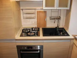 Photo of kitchen with stove and refrigerator photo