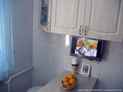 TV in the kitchen in a small kitchen photo
