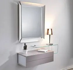 Mirror with a nightstand in the bedroom photo