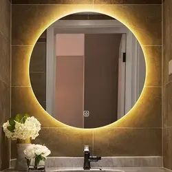 Round mirror with light in the bathroom photo