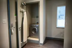 Hallway closet with washing machine photo