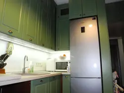 Refrigerator in a niche in the kitchen interior photo