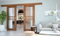 Interior double-leaf sliding doors in the living room interior photo