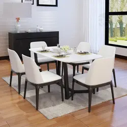 White Table And Black Chairs For The Kitchen Photo