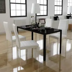 White Table And Black Chairs For The Kitchen Photo