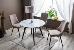 White table and black chairs for the kitchen photo