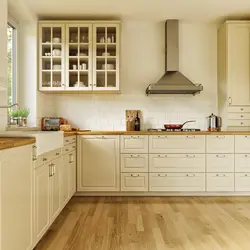 Cream kitchen with wooden countertop and apron photo