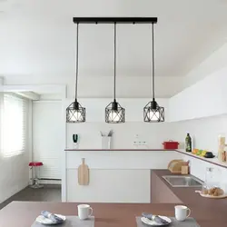 Hanging lamps above the bar counter in the kitchen photo