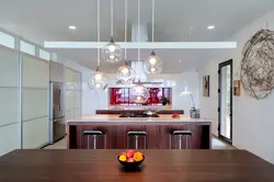 Hanging lamps above the bar counter in the kitchen photo