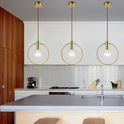 Hanging lamps above the bar counter in the kitchen photo