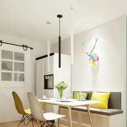 Hanging lamps above the bar counter in the kitchen photo