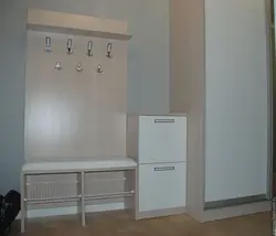 Hallway closet with shoe rack and hanger photo