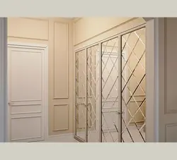 White wardrobe in the hallway with a mirror photo