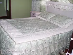 Bedspread With Flowers For The Bed In The Bedroom Photo
