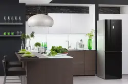 Black Refrigerator In A White Kitchen In The Interior Photo