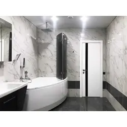 Combination of glossy and matte tiles in the bathroom photo