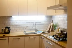 Kitchen apron made of white brick tiles photo