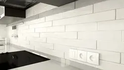 Kitchen Apron Made Of White Brick Tiles Photo