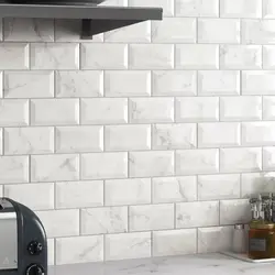 Kitchen apron made of white brick tiles photo
