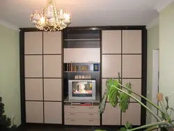 Wall cabinet in the living room with space for a TV photo