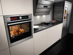 Photo of a kitchen with a pencil case for an oven and microwave