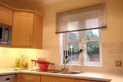 Blinds and curtains on one window in the kitchen photo