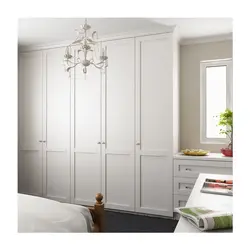 Wardrobe to the ceiling with hinged doors to the bedroom photo