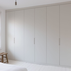 Wardrobe to the ceiling with hinged doors to the bedroom photo