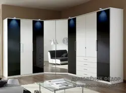 Wardrobe with hinged doors and mirror in the bedroom photo