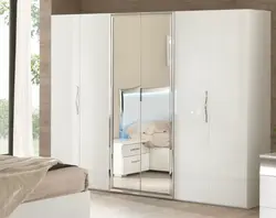 Wardrobe With Hinged Doors And Mirror In The Bedroom Photo
