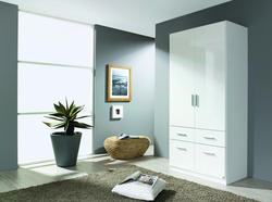 Wardrobe with hinged doors and mirror in the bedroom photo
