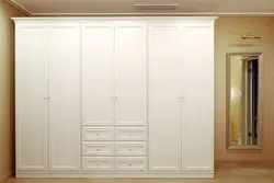 Wardrobe With Hinged Doors And Mirror In The Bedroom Photo