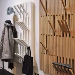Do-it-yourself wall hanger in the hallway made of slats photo