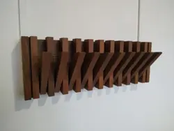 Do-it-yourself wall hanger in the hallway made of slats photo