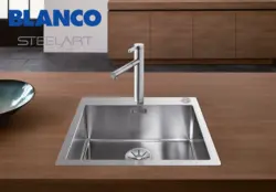 Stainless steel sink in the kitchen interior